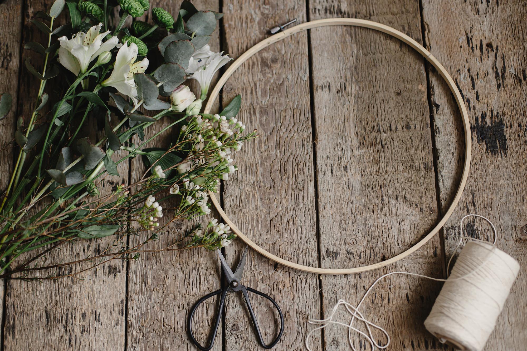 Hand-stitched floral hoop on wooden table